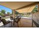 Inviting covered patio with outdoor seating and shade awning, perfect for relaxing and entertaining in the backyard at 2726 S 160Th Ave, Goodyear, AZ 85338