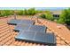 Close up on newly installed and efficient solar panels on a red tile roof at 2726 S 160Th Ave, Goodyear, AZ 85338