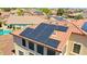 A detailed shot focuses on the solar panels integrated into the terracotta roof of the home, highlighting energy efficiency at 2726 S 160Th Ave, Goodyear, AZ 85338