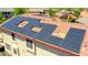 Aerial close up of solar panels installed on a red tile roof at 2726 S 160Th Ave, Goodyear, AZ 85338