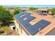 An aerial view shows the home's installed solar panels on a terracotta tile roof, offering energy efficiency at 2726 S 160Th Ave, Goodyear, AZ 85338