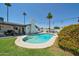 Lush backyard featuring a swimming pool, patio, and a well-maintained lawn at 2820 E Surrey Ave, Phoenix, AZ 85032