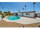 Backyard featuring a pool, patio, white exterior with colorful string lights, and landscaping at 2820 E Surrey Ave, Phoenix, AZ 85032