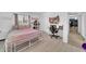 Cozy bedroom features a white metal frame bed, desk, closet, and light wood flooring at 2820 E Surrey Ave, Phoenix, AZ 85032