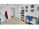 bedroom featuring a desk, shelf for display, and light-colored wood floors at 2820 E Surrey Ave, Phoenix, AZ 85032