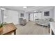 Bedroom features light-colored wood floors, ceiling fan, and gray rocking chair at 2820 E Surrey Ave, Phoenix, AZ 85032