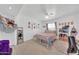 Bright bedroom with decorated ceiling, closet, desk, light wood flooring, and personalized decor at 2820 E Surrey Ave, Phoenix, AZ 85032