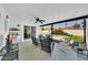 Inviting covered patio with ceiling fan, seating, and view of the sparkling pool and backyard at 2820 E Surrey Ave, Phoenix, AZ 85032
