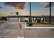 Lovely single-story home featuring a well-manicured lawn, solar panels, and covered parking at 2820 E Surrey Ave, Phoenix, AZ 85032
