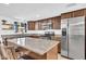 Kitchen featuring granite countertops, stainless steel appliances, and a central island at 2820 E Surrey Ave, Phoenix, AZ 85032