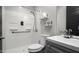 This bathroom features a shower with a shower seat, a toilet, and a vanity at 2915 W Night Owl Ln, Phoenix, AZ 85085