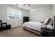 Comfortable bedroom offers natural light from the window and ample storage at 2915 W Night Owl Ln, Phoenix, AZ 85085