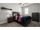 Cozy bedroom features a ceiling fan, side tables, and a modern dresser at 2915 W Night Owl Ln, Phoenix, AZ 85085