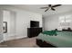 This bedroom has a bed, a desk, and two side tables with lamps at 2915 W Night Owl Ln, Phoenix, AZ 85085