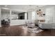 Elegant living room featuring hardwood floors, modern furniture, and ample natural light at 2915 W Night Owl Ln, Phoenix, AZ 85085