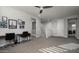This loft has a ceiling fan and a desk with chairs in a light, bright space at 2915 W Night Owl Ln, Phoenix, AZ 85085