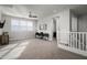 This loft has a desk and chairs in a large room with a ceiling fan and lots of light at 2915 W Night Owl Ln, Phoenix, AZ 85085