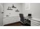 Bright home office featuring built-in cabinets, a comfortable desk setup, and a window with natural light at 2915 W Night Owl Ln, Phoenix, AZ 85085
