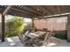 Charming outdoor patio with a pergola, ceiling fan, and a comfortable seating area at 2915 W Night Owl Ln, Phoenix, AZ 85085