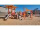 A well-maintained playground with slides, climbing structures, and a soft landing surface for safety at 2915 W Night Owl Ln, Phoenix, AZ 85085
