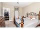Bedroom with a closet, carpet, and metal bed frame at 30089 W Rockmount Ave, Buckeye, AZ 85396