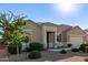Attractive single-story home boasting desert landscaping, a quaint front porch, and a two-car garage at 30089 W Rockmount Ave, Buckeye, AZ 85396