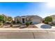 Charming single-story home with desert landscaping, mature trees, and a two-car garage at 30089 W Rockmount Ave, Buckeye, AZ 85396
