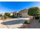 Attractive single-story home boasting desert landscaping, mature trees, and a two-car garage at 30089 W Rockmount Ave, Buckeye, AZ 85396