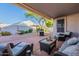 Backyard with covered patio, seating area, fountain and tree at 31017 N 41St Pl, Cave Creek, AZ 85331