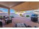 Backyard features a fountain, barbecue, covered patio, and desert landscaping at 31017 N 41St Pl, Cave Creek, AZ 85331