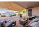 Backyard with covered patio, seating area, and a fountain feature at 31017 N 41St Pl, Cave Creek, AZ 85331