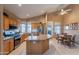 Well-lit kitchen with stainless steel appliances, central island, and adjoining dining nook at 31017 N 41St Pl, Cave Creek, AZ 85331