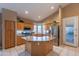 Open kitchen with a large island, stainless steel appliances, and ample counter space at 31017 N 41St Pl, Cave Creek, AZ 85331