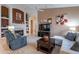 Comfortable living room features a fireplace, media center, and neutral colors at 31017 N 41St Pl, Cave Creek, AZ 85331