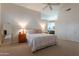 Spacious main bedroom featuring plush carpet, a large bed, and access to an ensuite bathroom at 31017 N 41St Pl, Cave Creek, AZ 85331