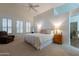 Spacious main bedroom features plush carpet, natural light, and en suite bathroom access at 31017 N 41St Pl, Cave Creek, AZ 85331