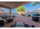 Covered patio area with comfortable seating and a built-in grill at 31017 N 41St Pl, Cave Creek, AZ 85331