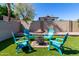 Backyard with fire pit and blue Adirondack chairs at 4316 E Janice Way, Phoenix, AZ 85032