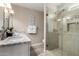 Bright bathroom featuring granite countertops, a glass shower, and modern fixtures at 4316 E Janice Way, Phoenix, AZ 85032