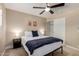 Neutral bedroom featuring a ceiling fan and closet at 4316 E Janice Way, Phoenix, AZ 85032