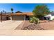 Charming one-story home featuring desert landscaping, a two-car garage and a basketball hoop at 4316 E Janice Way, Phoenix, AZ 85032