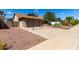 Home featuring desert landscaping, a two-car garage and a basketball hoop at 4316 E Janice Way, Phoenix, AZ 85032
