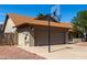 Side angle view of the two-car garage and basketball hoop at 4316 E Janice Way, Phoenix, AZ 85032