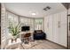 Bright home office with built-in cabinets and a view of the pool at 4316 E Janice Way, Phoenix, AZ 85032