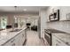 Bright kitchen with stainless steel appliances, granite countertops and view to a sitting room at 4316 E Janice Way, Phoenix, AZ 85032
