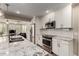Modern kitchen with stainless steel appliances, granite countertops and white subway tile backsplash at 4316 E Janice Way, Phoenix, AZ 85032