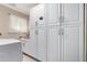 Laundry room featuring ample white cabinet storage and a washer/dryer at 4316 E Janice Way, Phoenix, AZ 85032
