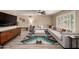 The open living room features modern furniture and wood look tile floors at 4316 E Janice Way, Phoenix, AZ 85032