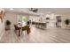 Open concept living space boasts a modern kitchen, dining area, and cozy seating at 4316 E Janice Way, Phoenix, AZ 85032