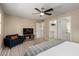 Spacious main bedroom offers ample closet space and a comfortable sitting area with a flat screen TV at 4316 E Janice Way, Phoenix, AZ 85032